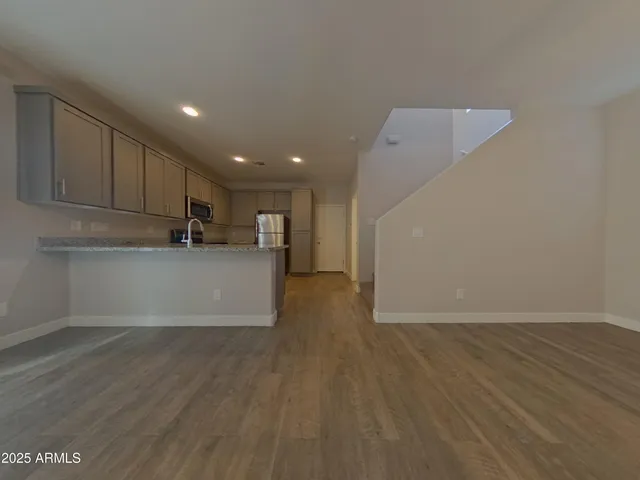 a view of kitchen with wooden floor