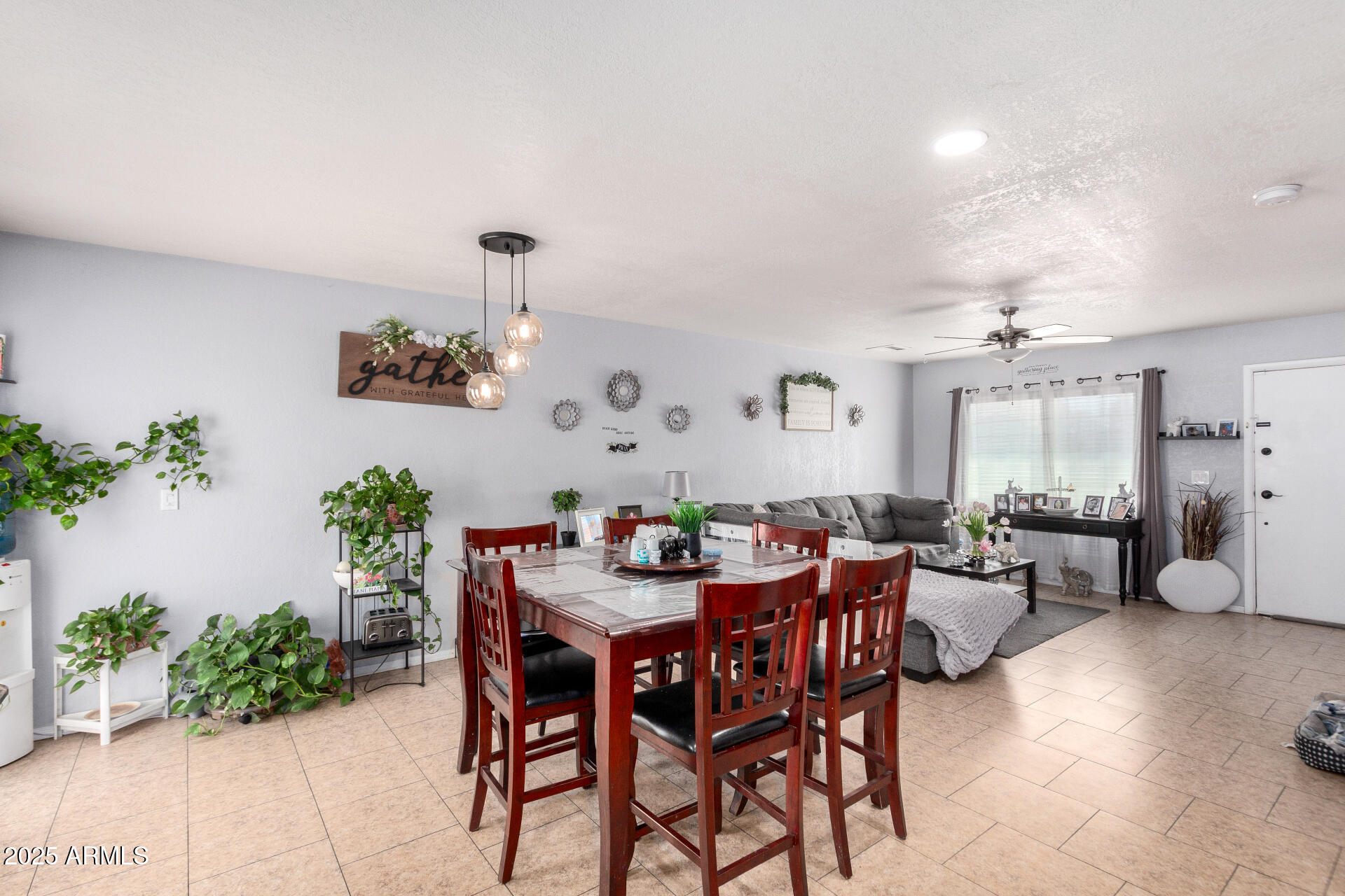 12608 West Lower Buckeye Road Avondale, AZ 85323 - Photo 11 of 26 a view of a dining room with furniture