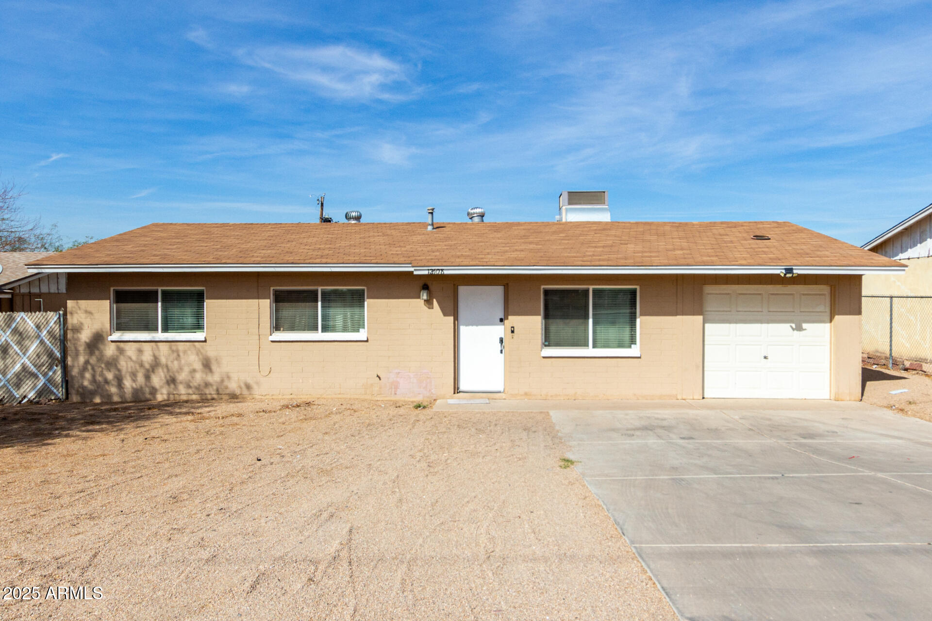 12608 West Lower Buckeye Road Avondale, AZ 85323 - Photo 2 of 26 a front view of a house with a outdoor space
