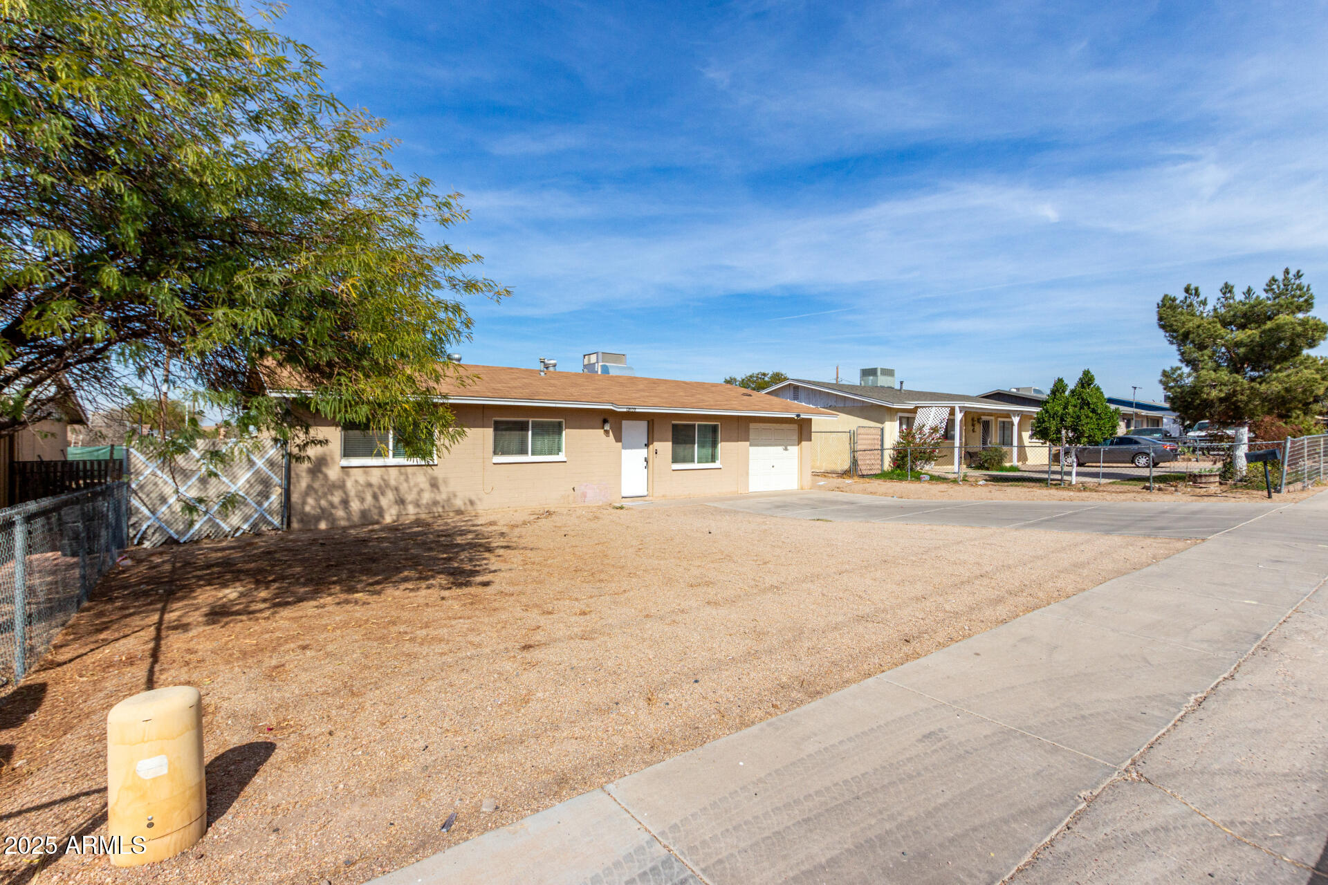 12608 West Lower Buckeye Road Avondale, AZ 85323 - Photo 3 of 26 a front view of a house with a yard
