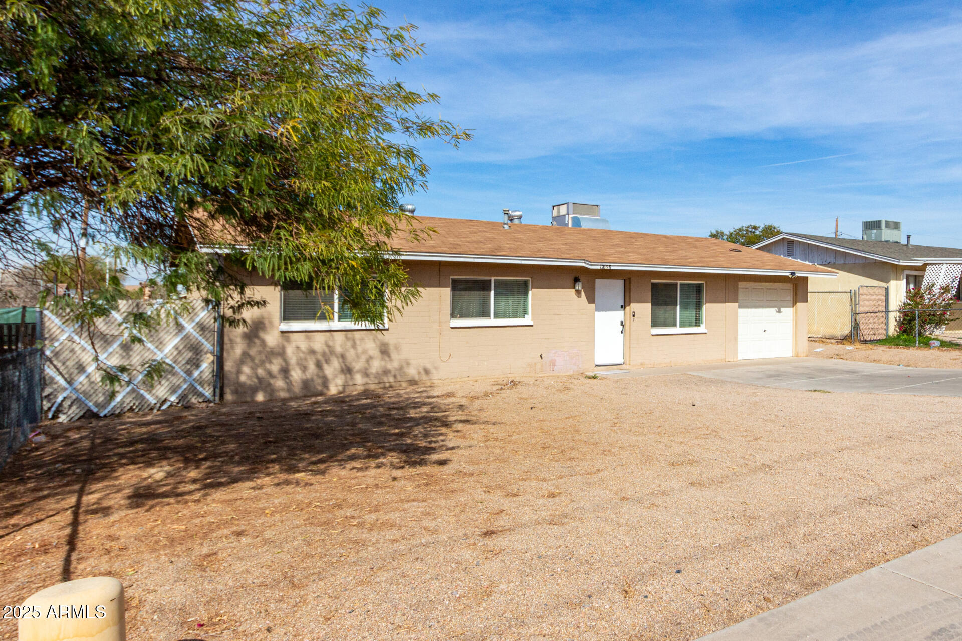 12608 West Lower Buckeye Road Avondale, AZ 85323 - Photo 4 of 26 a front view of a house with a yard