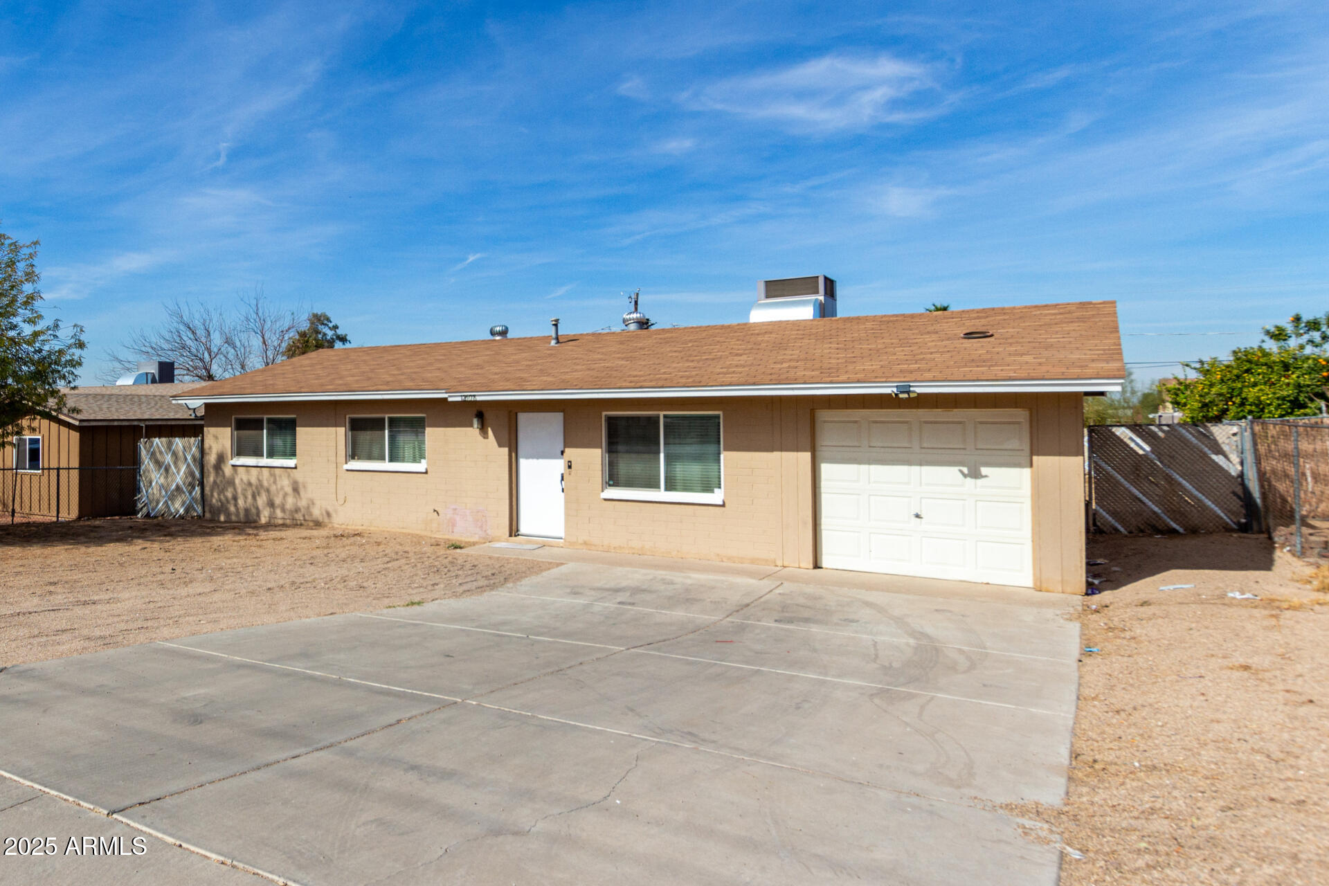 12608 West Lower Buckeye Road Avondale, AZ 85323 - Photo 6 of 26 a front view of a house with a yard