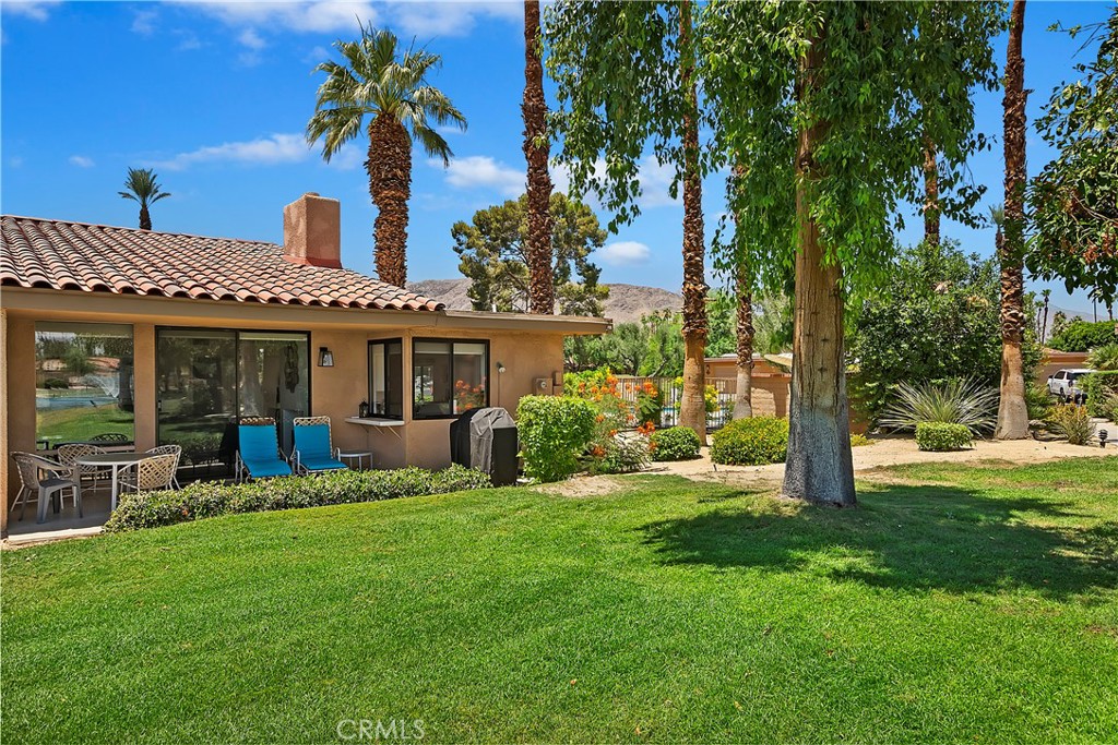 8 Valencia Drive Rancho Mirage, CA 92270 - Photo 12 of 20 front view of a house with a yard