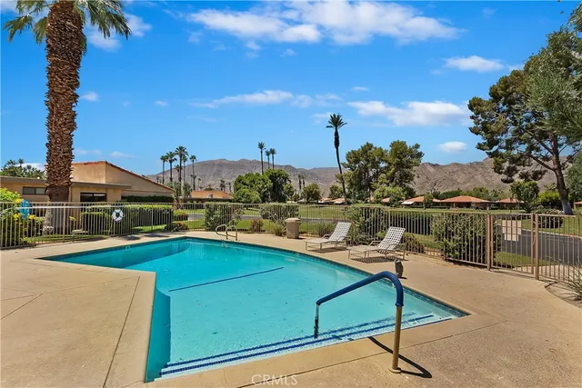 a view of a patio with swimming pool