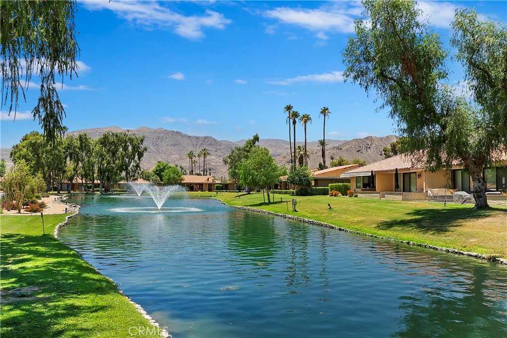8 Valencia Drive Rancho Mirage, CA 92270 - Photo 16 of 20 a view of a swimming pool with a garden