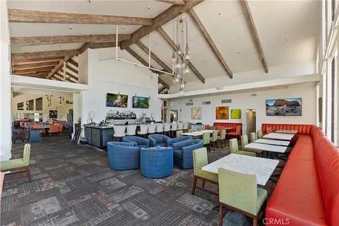 a living room with lots of furniture and clutter