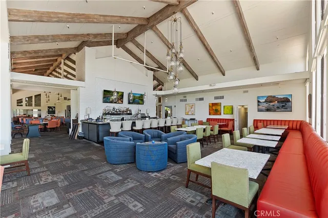 a living room with lots of furniture and clutter