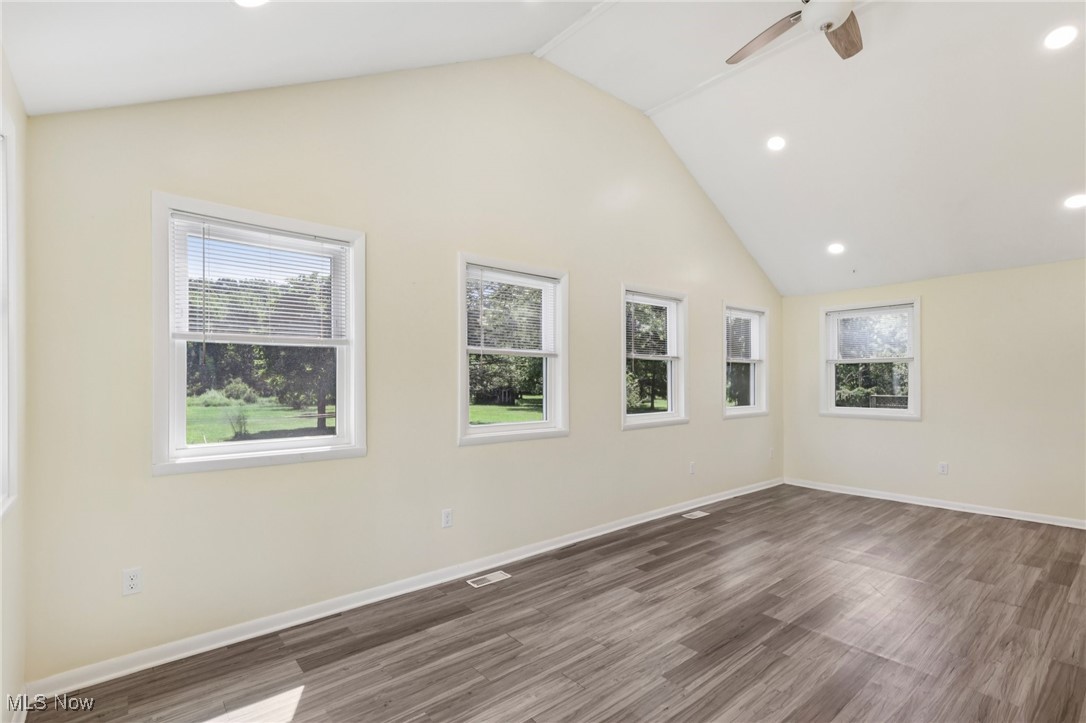 5097 Chillicothe Road Chagrin Falls, OH 44022 - Photo 16 of 45 Spare room with recessed lighting, wood finished floors, ceiling fan, and high vaulted ceiling