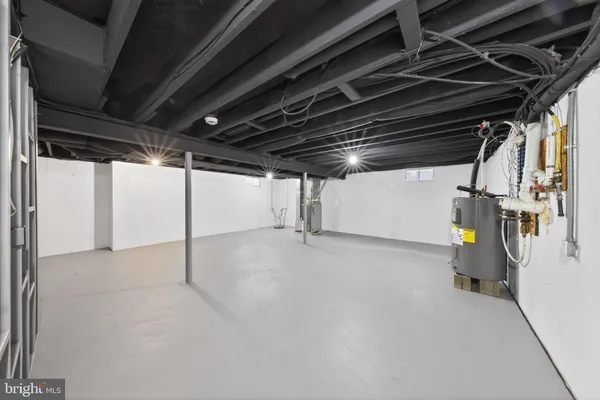 a view of empty room with wooden ceiling