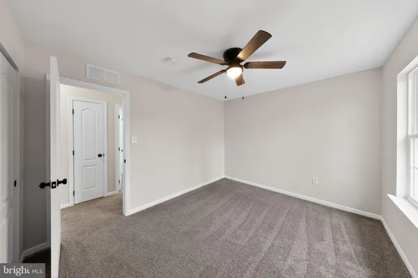 a view of an empty room and window