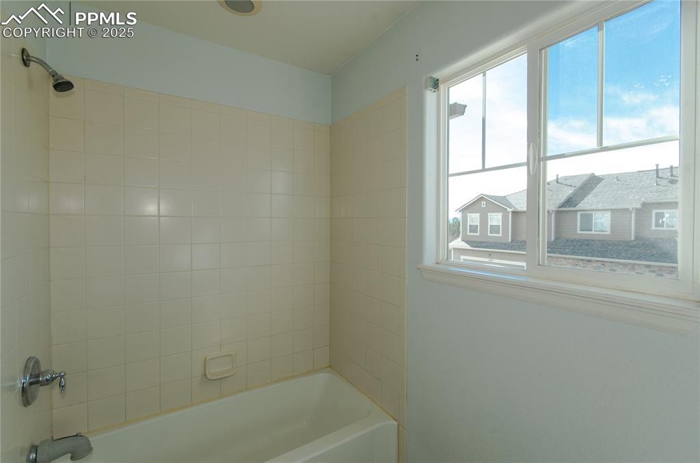 1316 Walters Point Monument, CO 80132 - Photo 22 of 33 a bath tub sitting next to a window