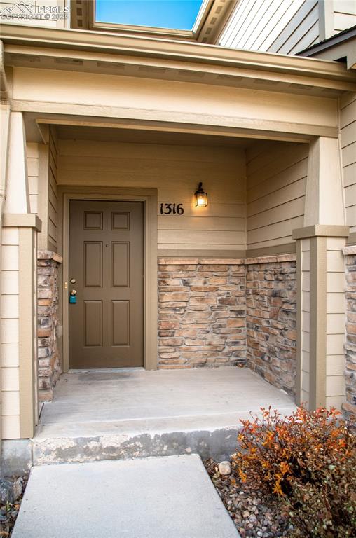 1316 Walters Point Monument, CO 80132 - Photo 3 of 33 a view of front door of a house