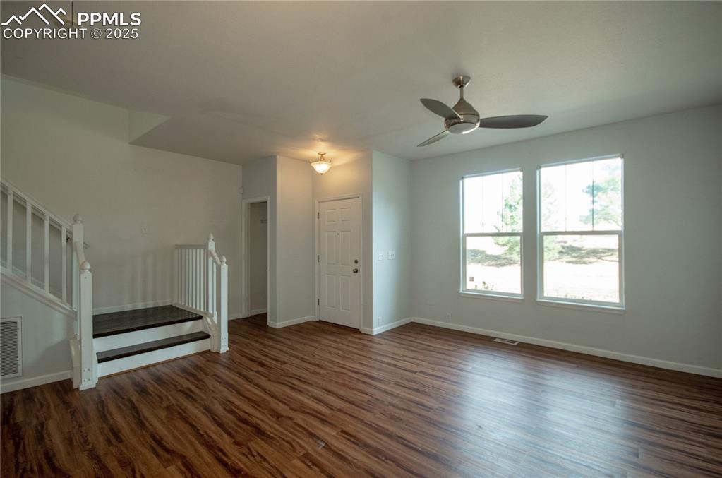 1316 Walters Point Monument, CO 80132 - Photo 5 of 33 a view of livingroom with hardwood floor and a ceiling fan