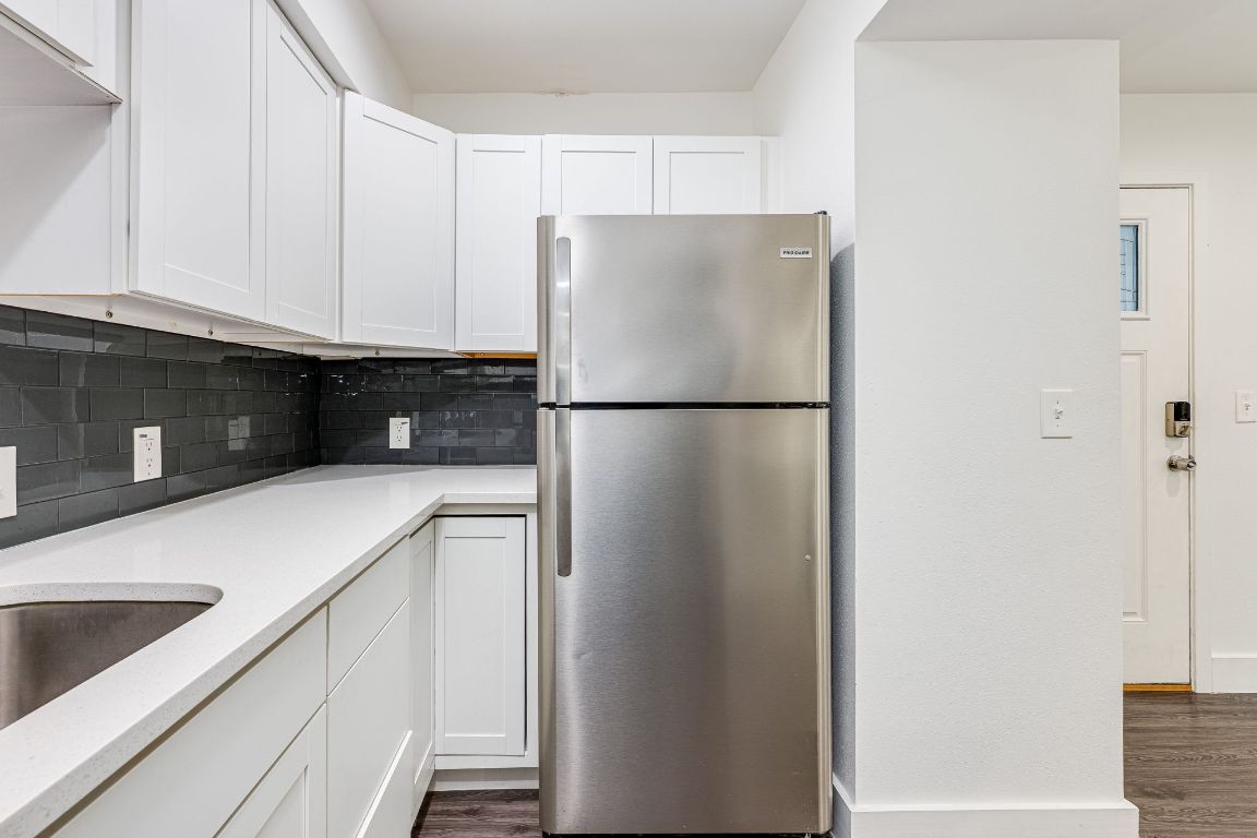935 La Posada Drive, Unit 156 Austin, TX 78752 - Photo 11 of 40 a white refrigerator freezer sitting in a kitchen