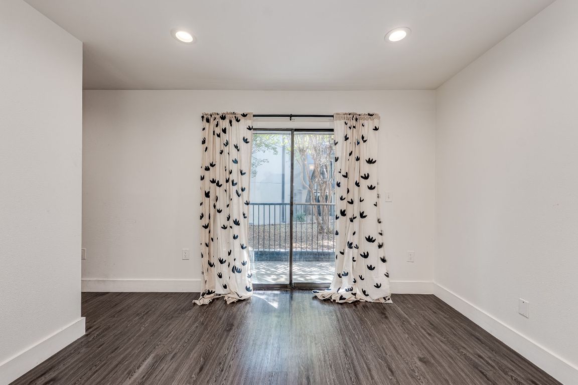 935 La Posada Drive, Unit 156 Austin, TX 78752 - Photo 12 of 40 a view of a big room with window and wooden floor