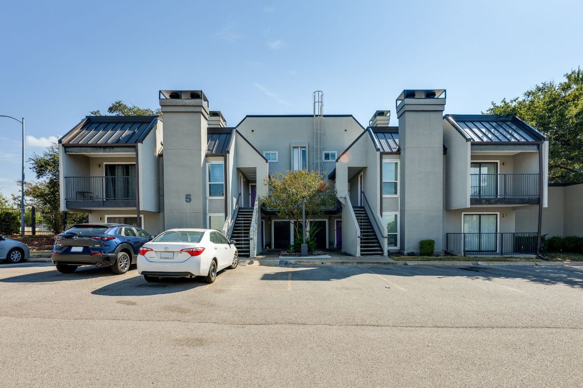 935 La Posada Drive, Unit 156 Austin, TX 78752 - Photo 23 of 40 a car parked in front of a building