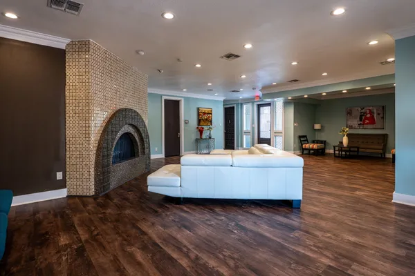 a living room with furniture and a fireplace