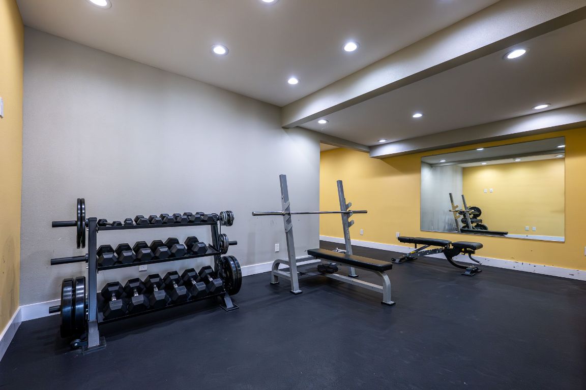 935 La Posada Drive, Unit 156 Austin, TX 78752 - Photo 33 of 40 a view of a room with gym equipment