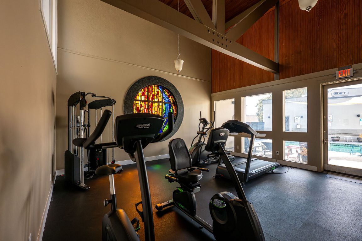 935 La Posada Drive, Unit 156 Austin, TX 78752 - Photo 34 of 40 a view of a room with gym equipment