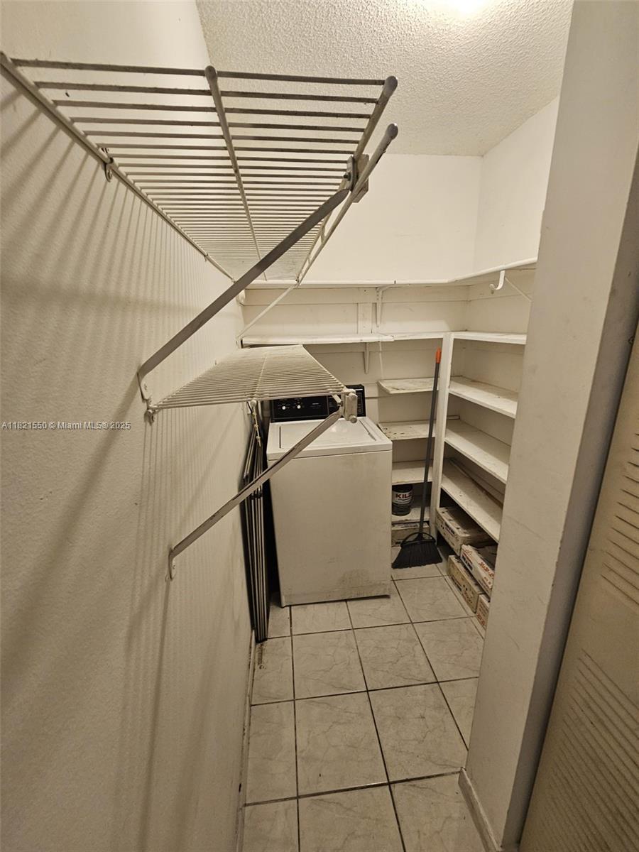 1555 West 44th Place, Unit 221B Hialeah, FL 33012 - Photo 12 of 15 a view of storage and utility room with washer and dryer