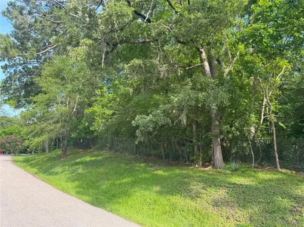 a view of outdoor space with deck and yard