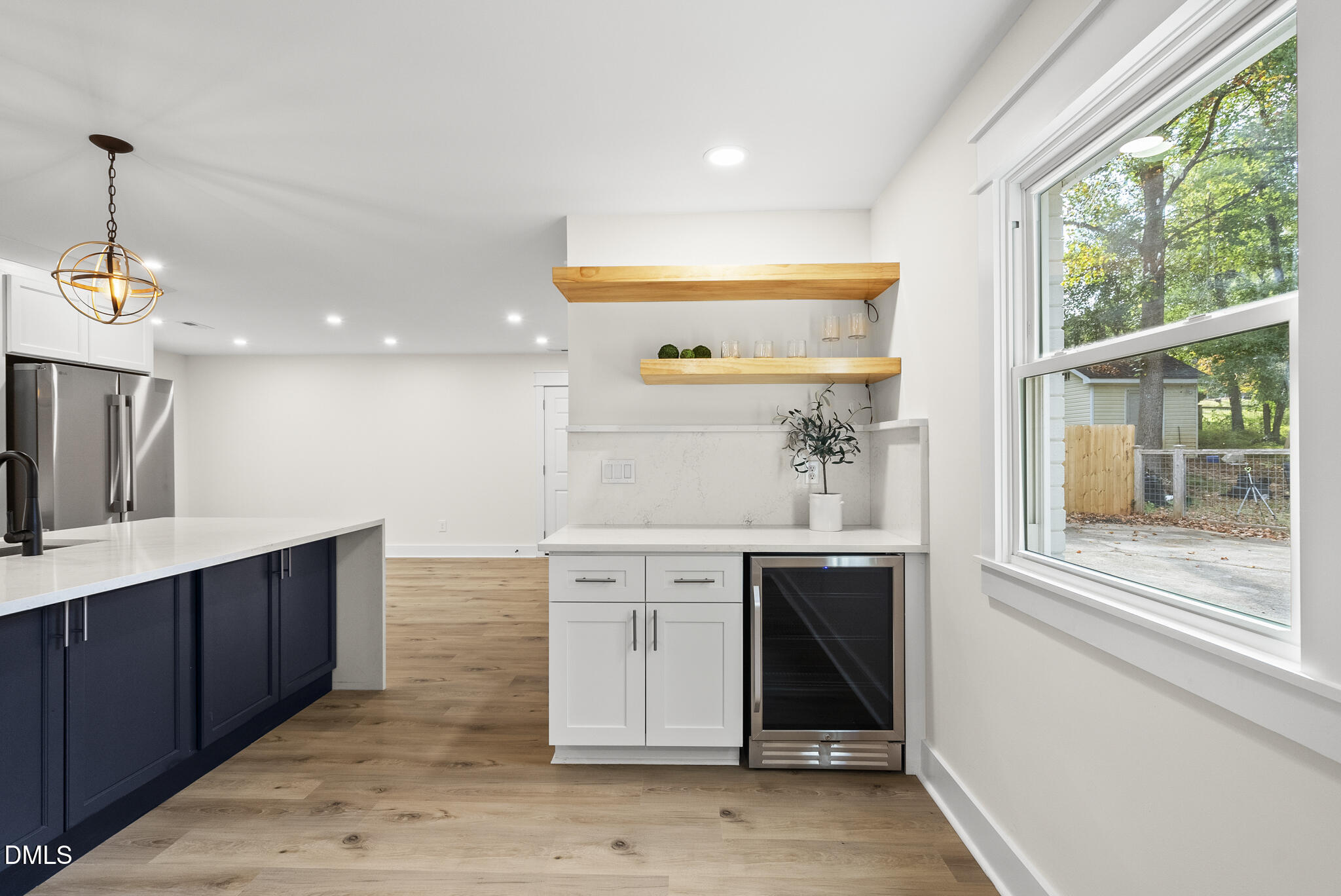 7804 Brandyapple Drive Raleigh, NC 27615 - Photo 12 of 58 a kitchen with a sink cabinets and window