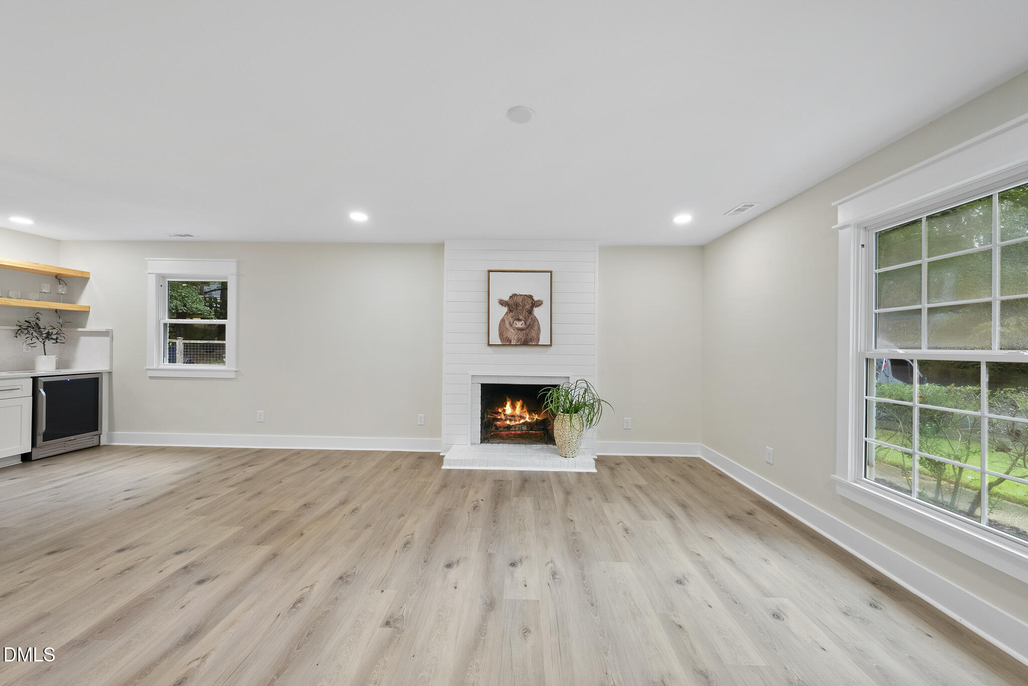 7804 Brandyapple Drive Raleigh, NC 27615 - Photo 18 of 58 a view of an empty room window and wooden floor