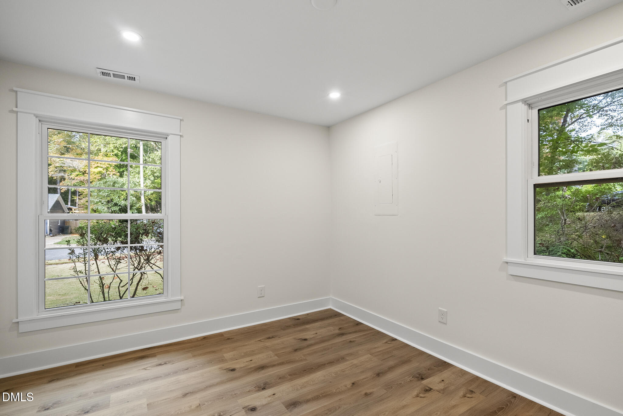 7804 Brandyapple Drive Raleigh, NC 27615 - Photo 29 of 58 a view of empty room with wooden floor and fan