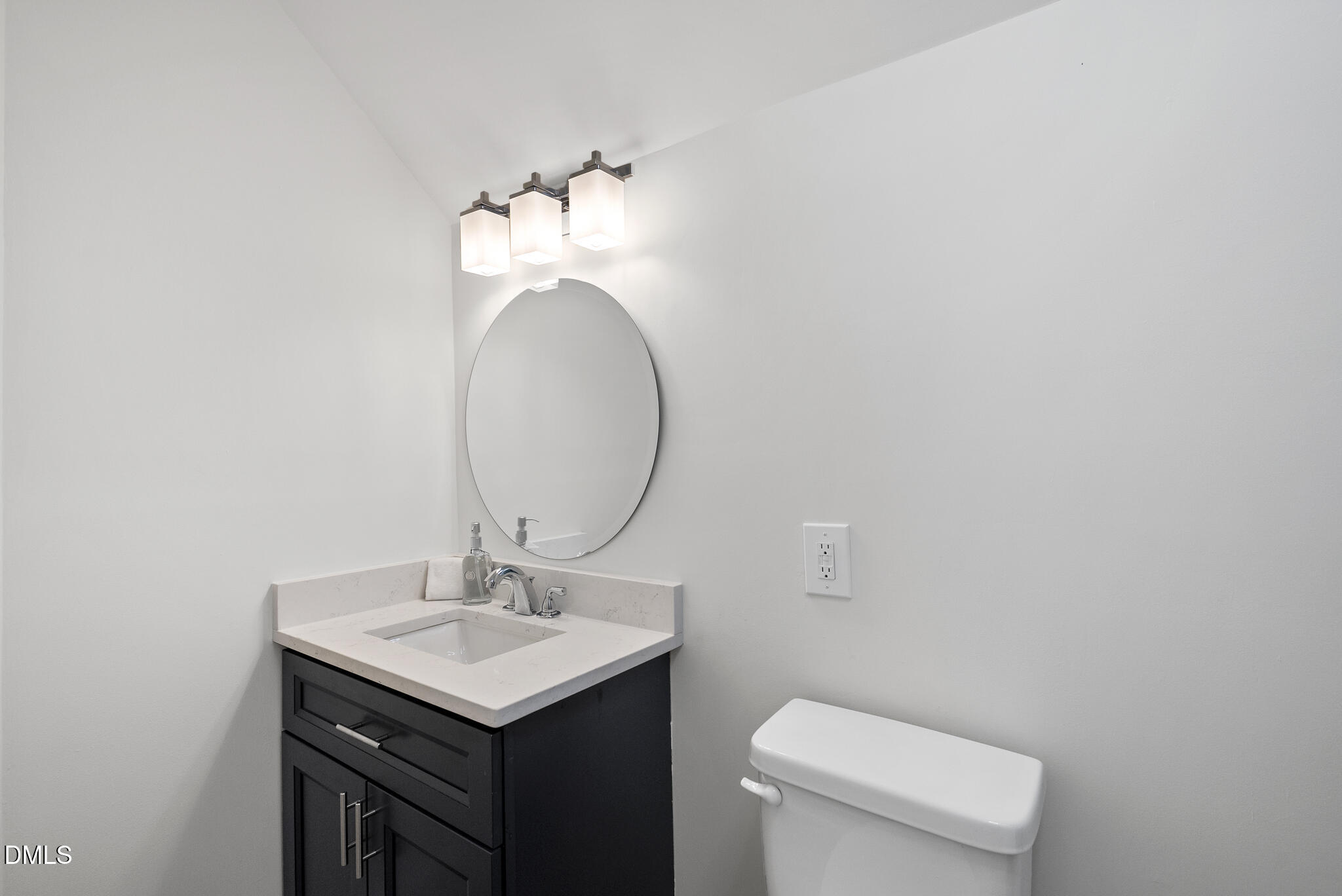 7804 Brandyapple Drive Raleigh, NC 27615 - Photo 35 of 58 a bathroom with a sink and a mirror