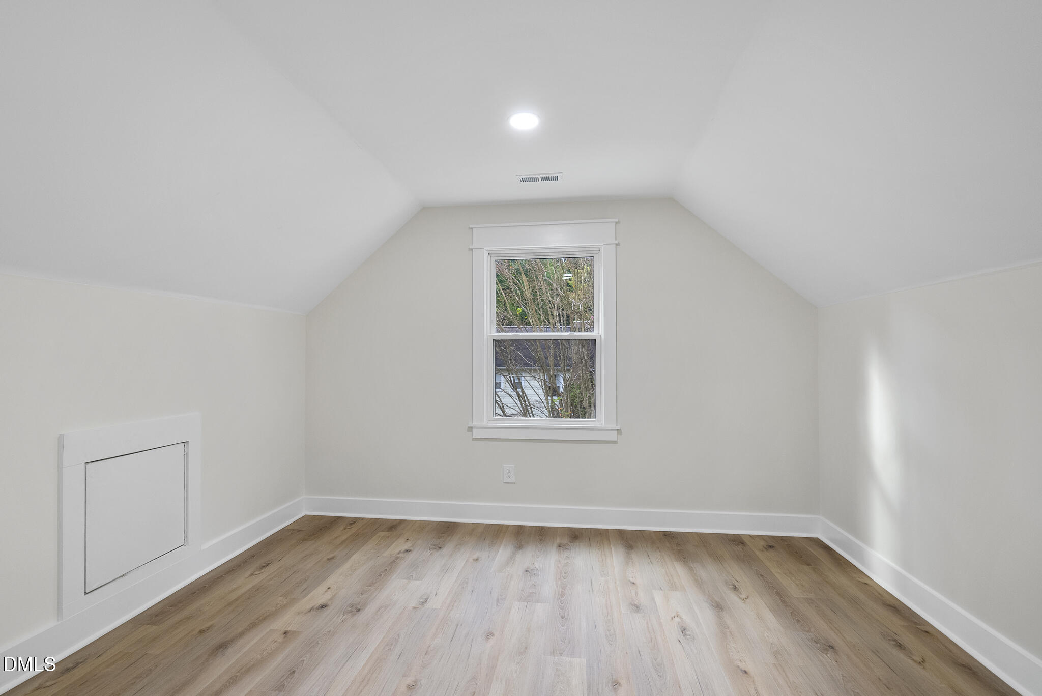 7804 Brandyapple Drive Raleigh, NC 27615 - Photo 37 of 58 an empty room with wooden floor and windows