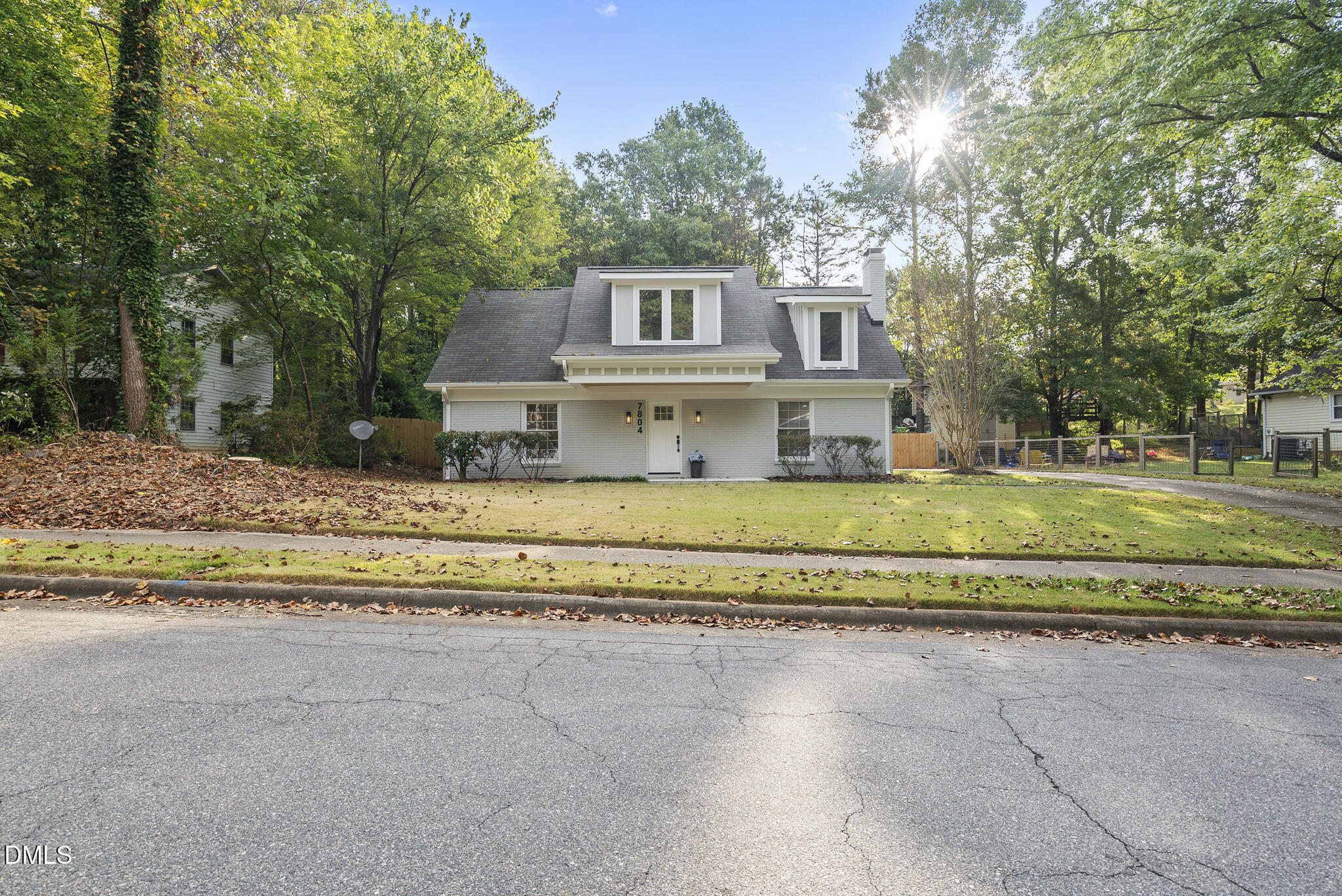 7804 Brandyapple Drive Raleigh, NC 27615 - Photo 56 of 58 a house with trees in the background