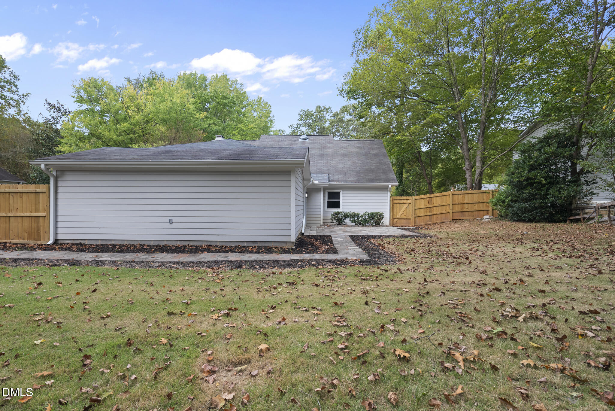 7804 Brandyapple Drive Raleigh, NC 27615 - Photo 58 of 58 a backyard of a house with plants and trees