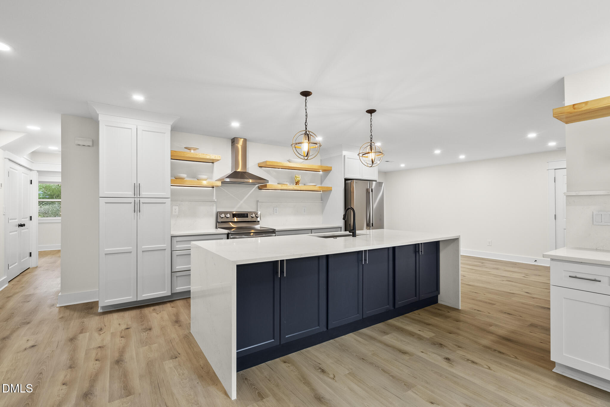 7804 Brandyapple Drive Raleigh, NC 27615 - Photo 6 of 58 a kitchen with kitchen island sink stove and refrigerator