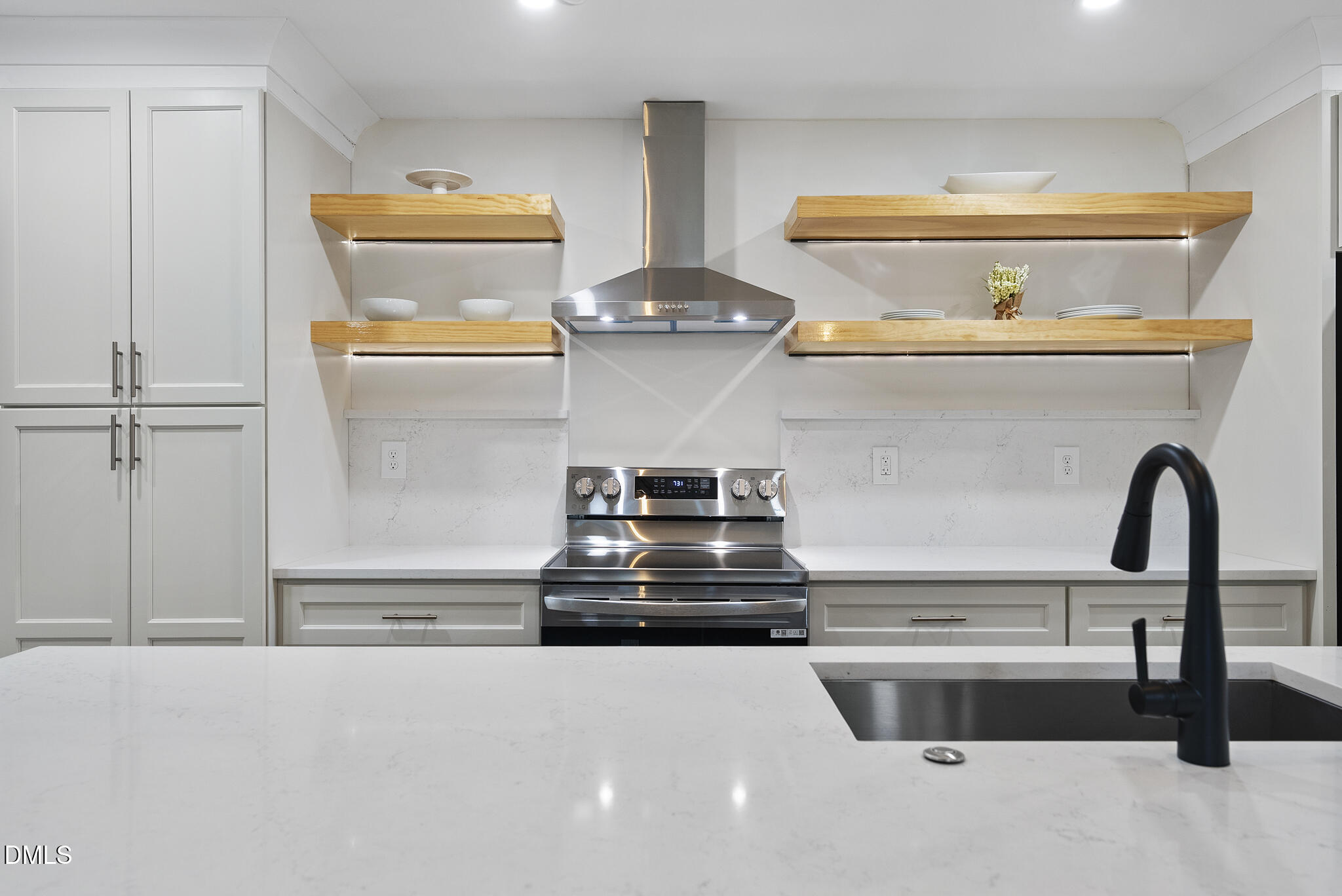 7804 Brandyapple Drive Raleigh, NC 27615 - Photo 9 of 58 a kitchen with a stove and a refrigerator