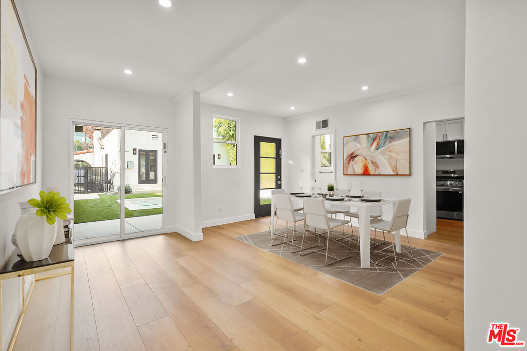 318 Huntley Drive West Hollywood, CA 90048 - Photo 17 of 25 a living room with furniture and a wooden floor