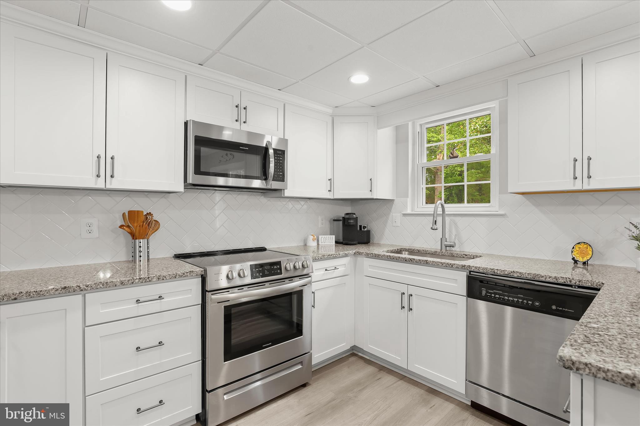 792 Match Point Drive Arnold, MD 21012 - Photo 5 of 43 a kitchen with cabinets appliances a sink and a window