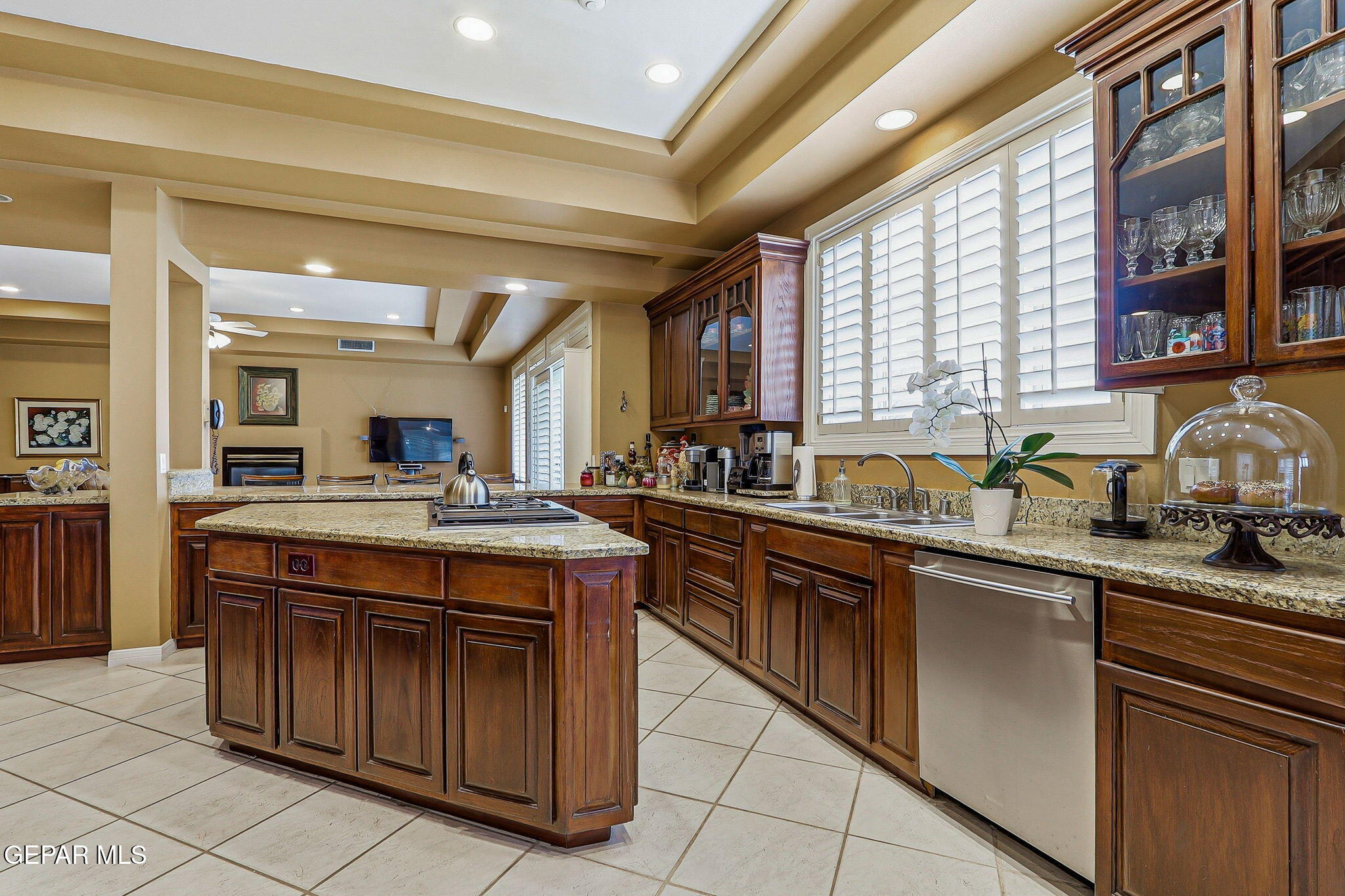 5806 Diamond Point Circle El Paso, TX 79912 - Photo 13 of 61 a kitchen with stainless steel appliances granite countertop a stove a sink and a refrigerator