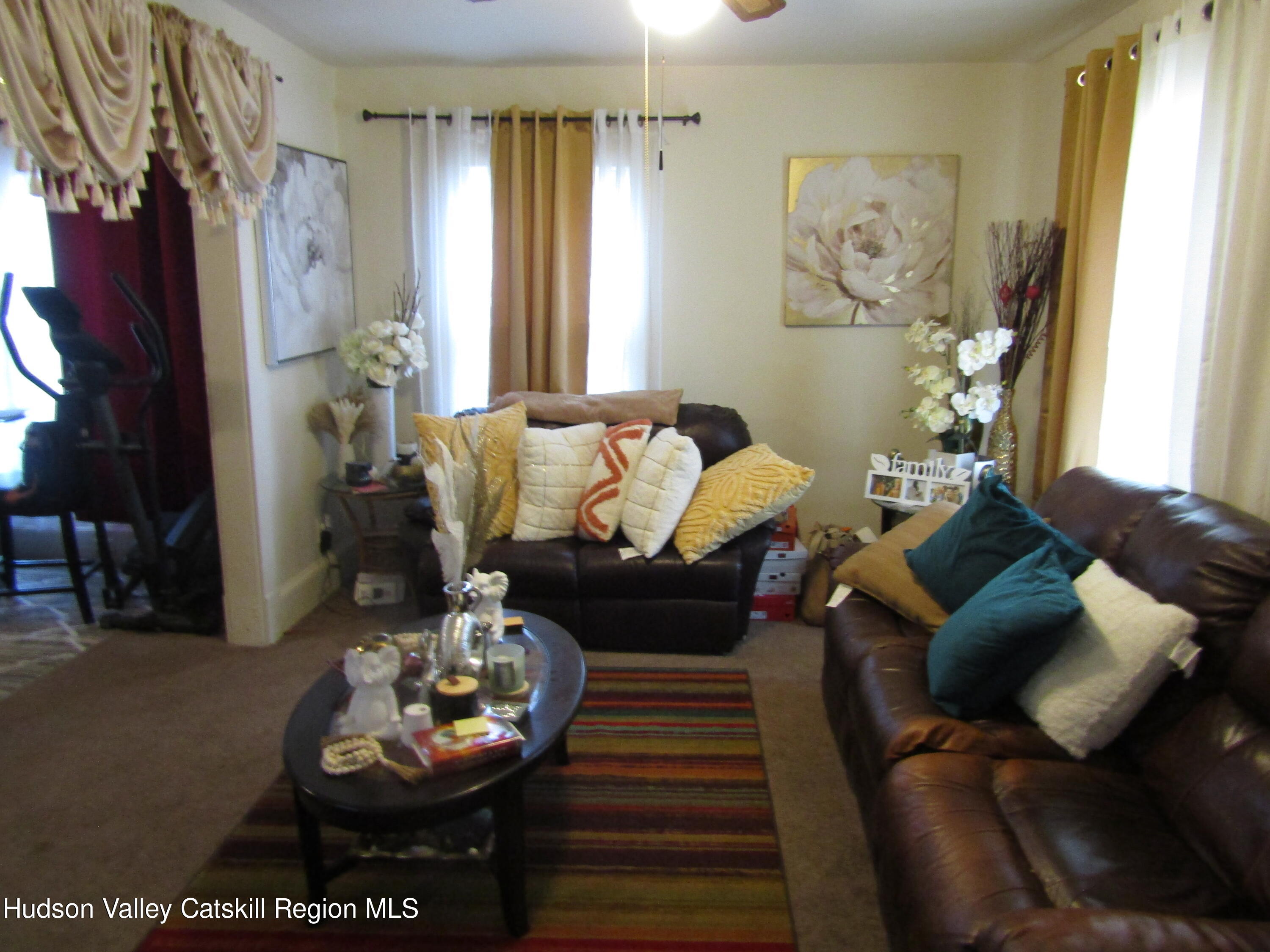 113 Pine Street Kingston, NY 12401 - Photo 13 of 21 a living room with furniture and a fireplace