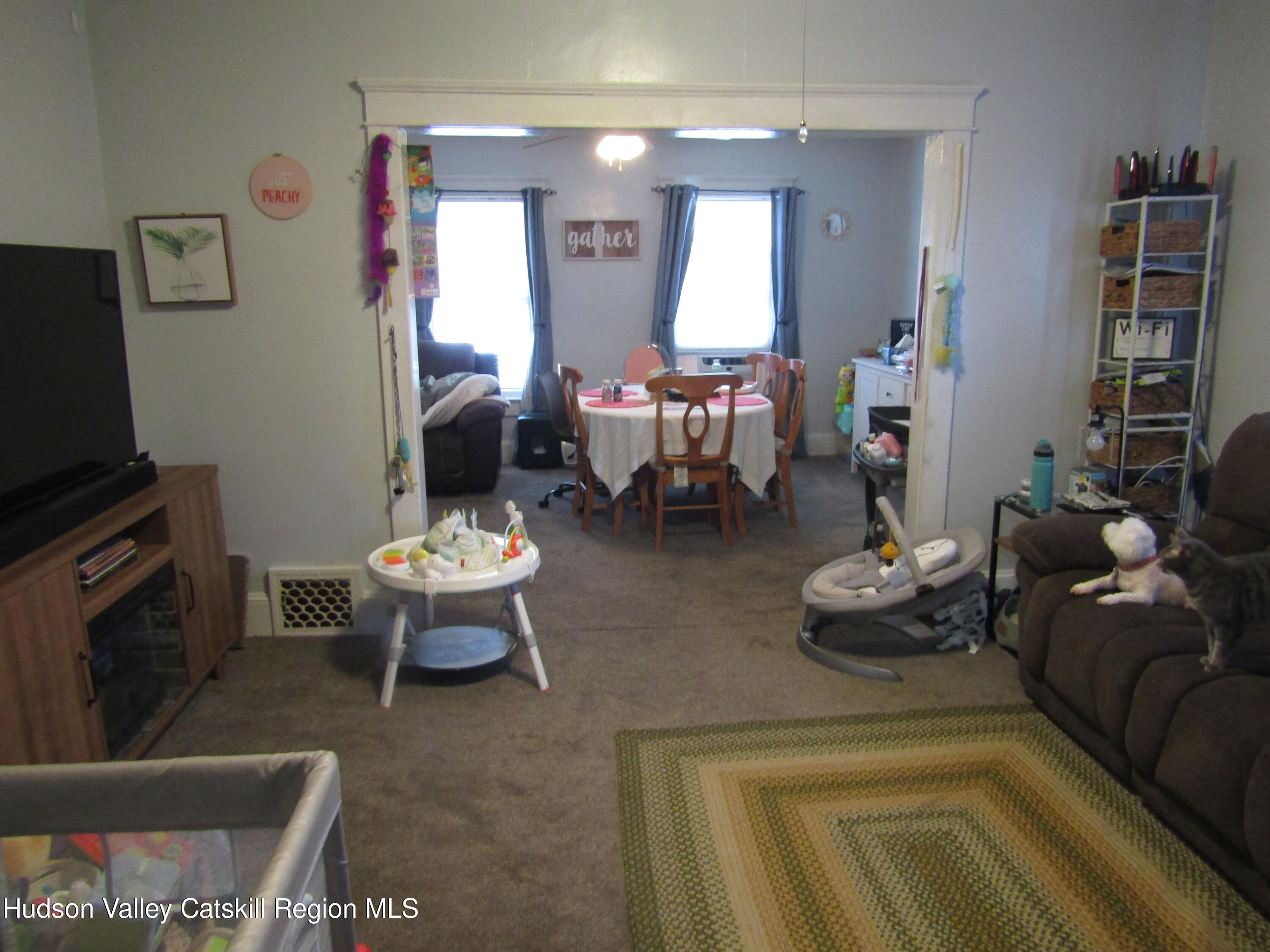 113 Pine Street Kingston, NY 12401 - Photo 7 of 21 a living room with furniture and a flat screen tv