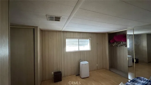a view of a hallway with closet area