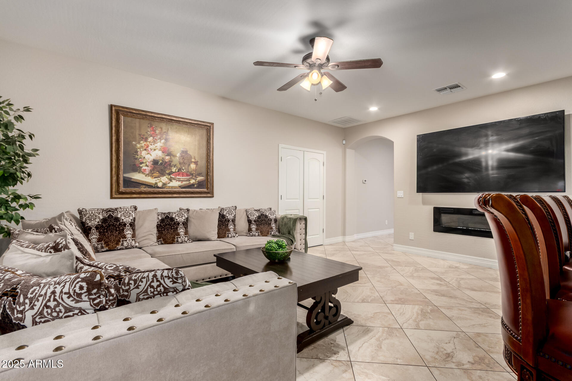 6344 West Lamar Road Glendale, AZ 85301 - Photo 11 of 37 a living room with furniture and a flat screen tv