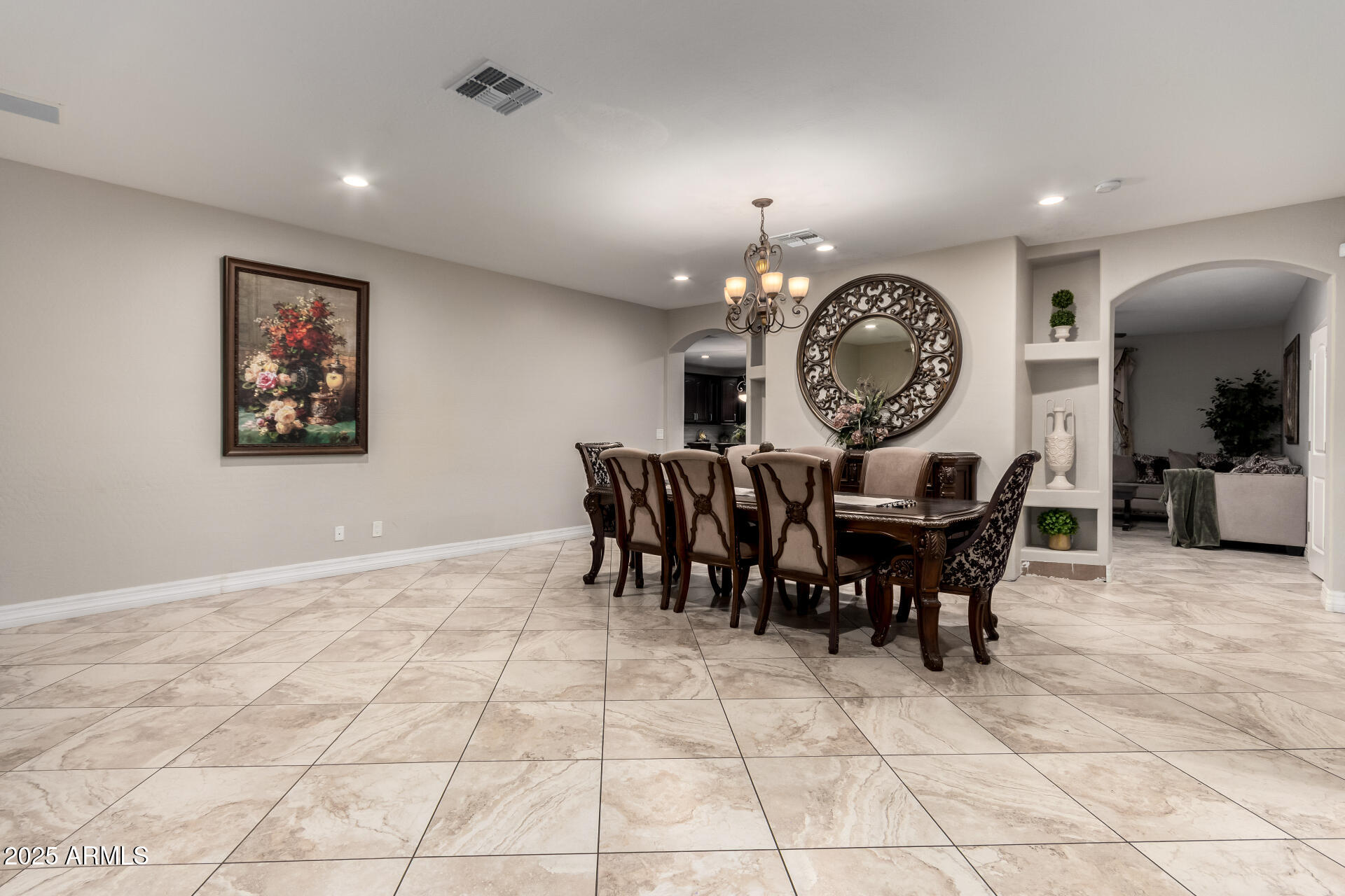 6344 West Lamar Road Glendale, AZ 85301 - Photo 14 of 37 a view of a dining room and kitchen with furniture and a large window