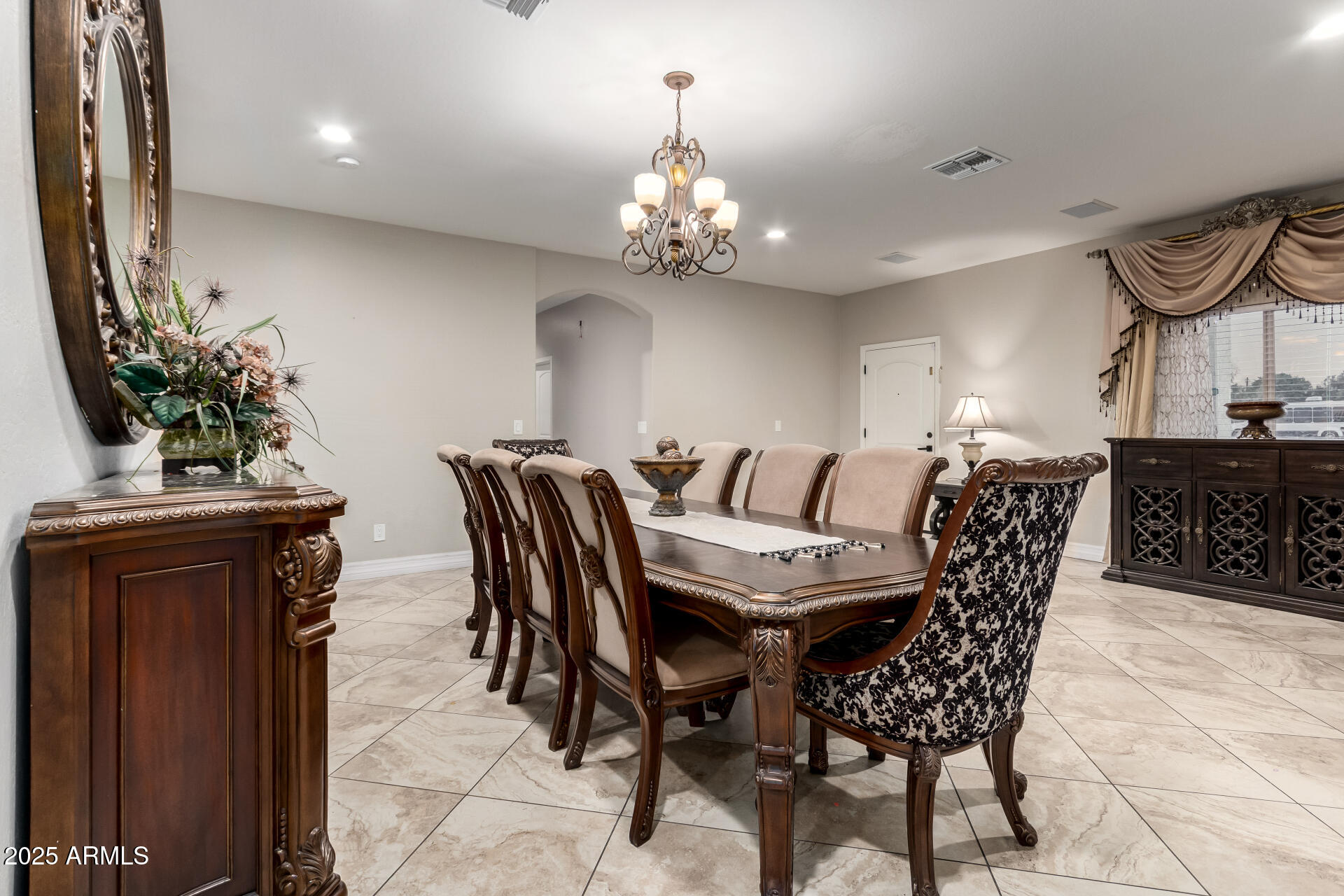 6344 West Lamar Road Glendale, AZ 85301 - Photo 16 of 37 a view of a dining room with furniture and chandelier