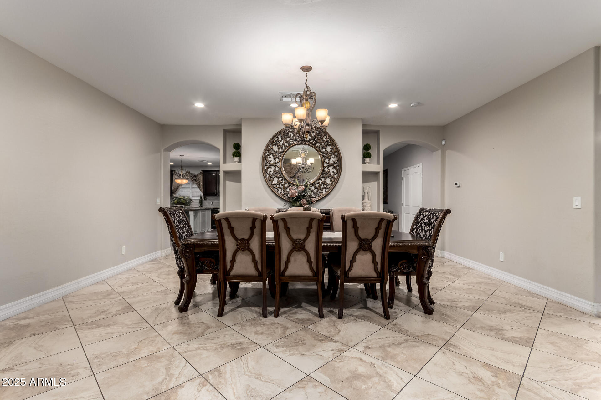 6344 West Lamar Road Glendale, AZ 85301 - Photo 18 of 37 a view of a dining room and hall with furniture