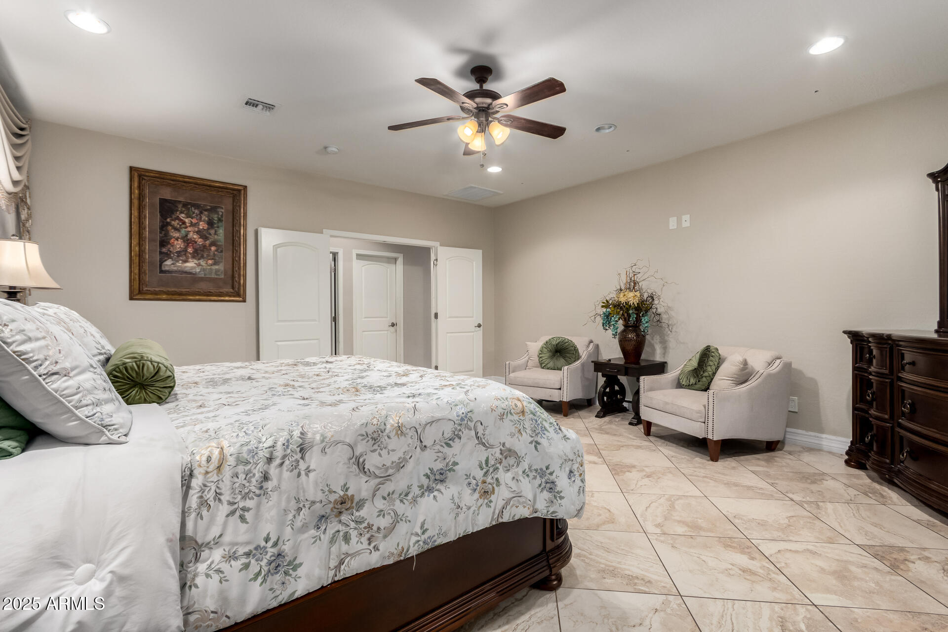 6344 West Lamar Road Glendale, AZ 85301 - Photo 27 of 37 a bedroom with a bed and ceiling fan