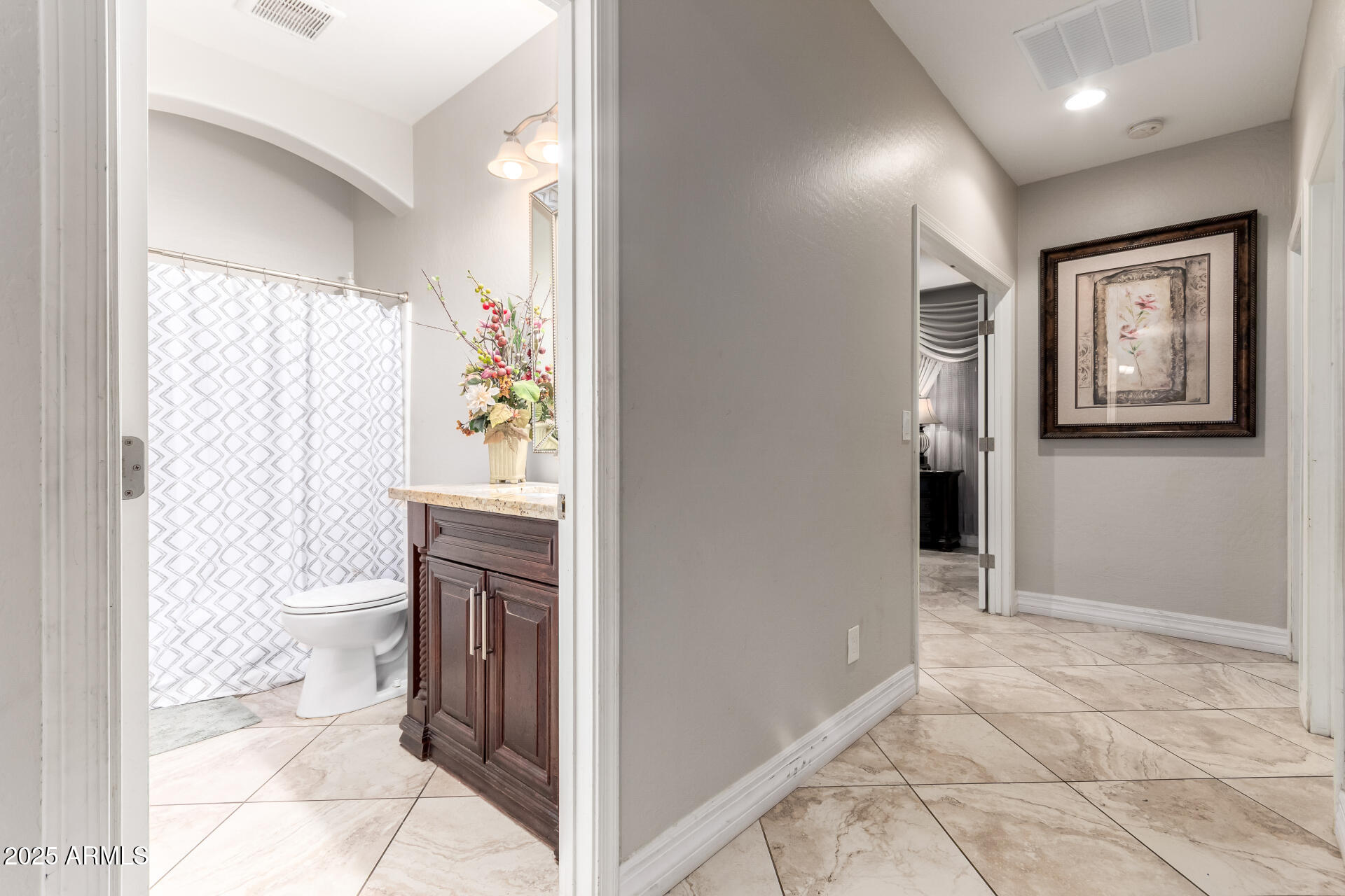 6344 West Lamar Road Glendale, AZ 85301 - Photo 35 of 37 a bathroom with a toilet sink and shower