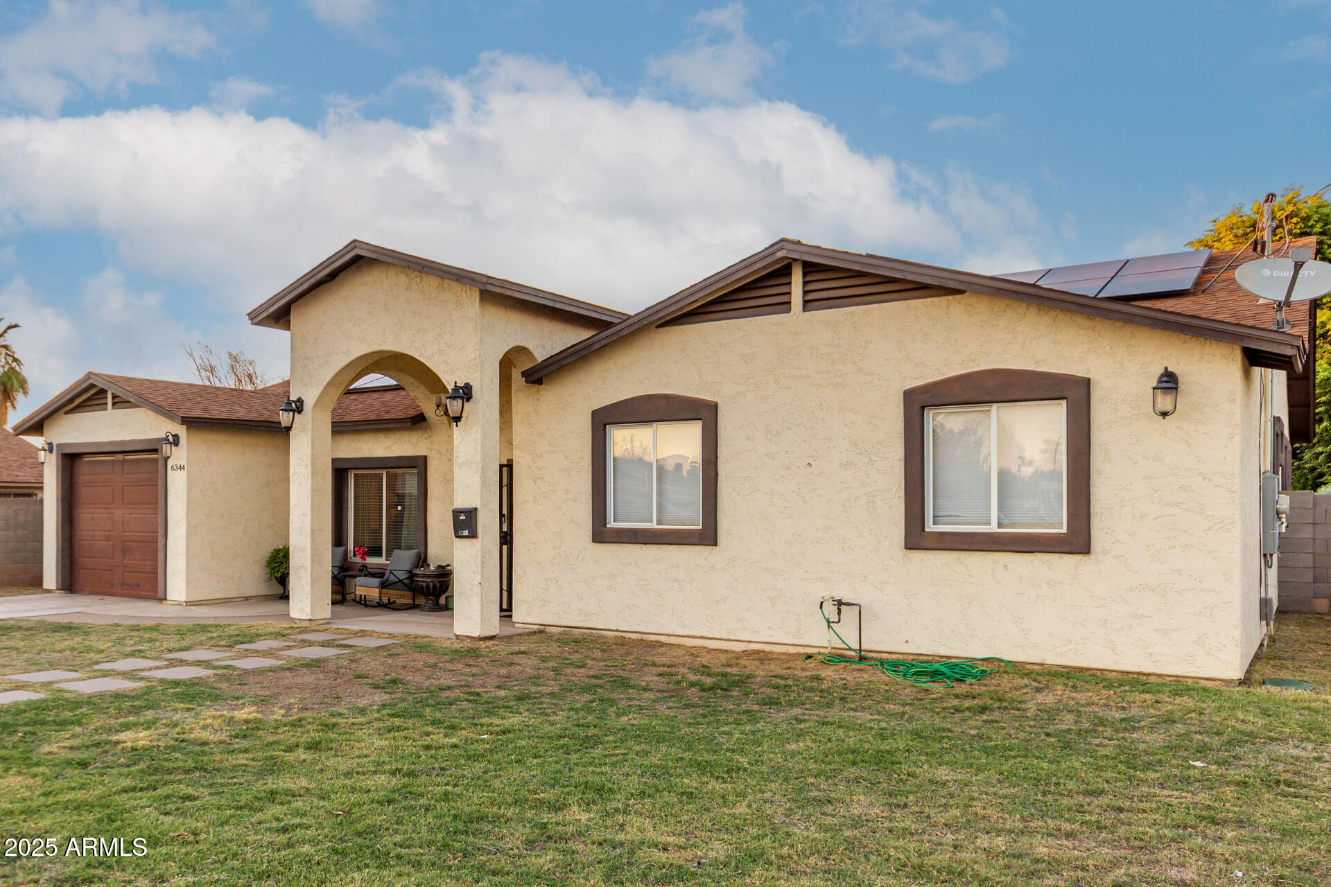 6344 West Lamar Road Glendale, AZ 85301 - Photo 4 of 37 a front view of a house with a yard