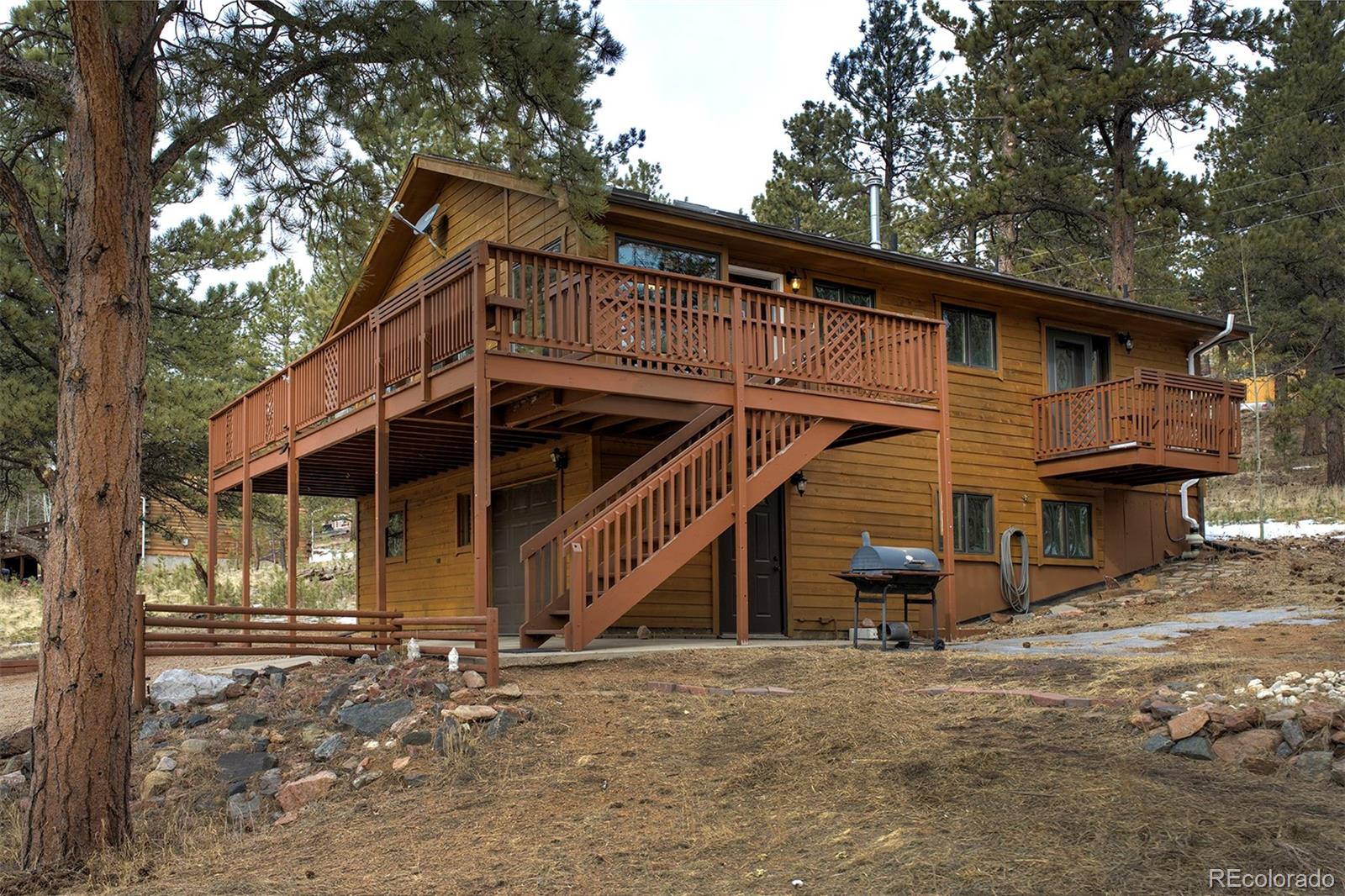371 Hall Road Bailey, CO 80421 - Photo 4 of 40 a view of a house with a yard