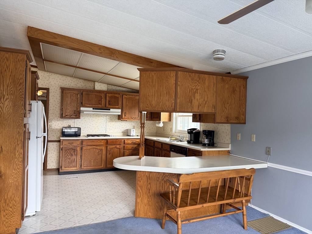 2 Emerald Place Raynham, MA 02767 - Photo 5 of 16 a kitchen with stainless steel appliances granite countertop a sink a stove and refrigerator