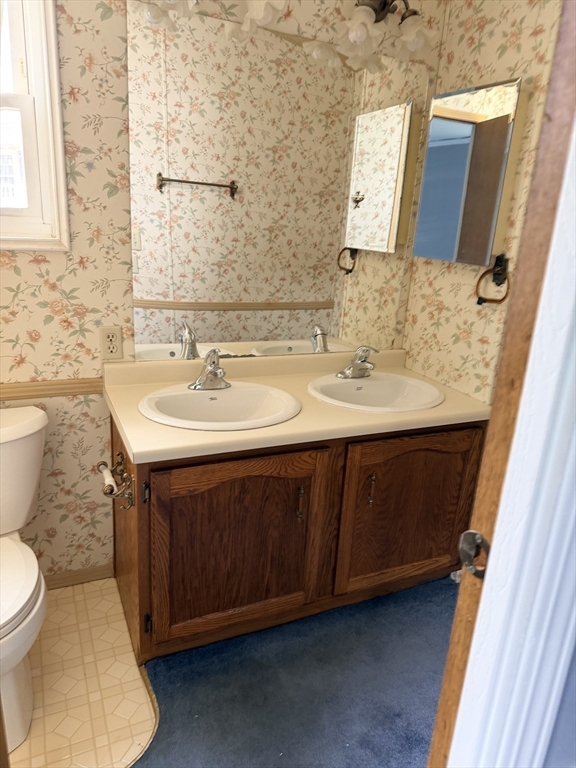 2 Emerald Place Raynham, MA 02767 - Photo 10 of 16 a bathroom with a sink and a toilet
